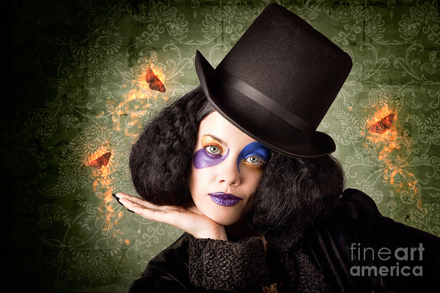 Stylish female magician performing magic trick #1 Photograph by Jorgo Photography