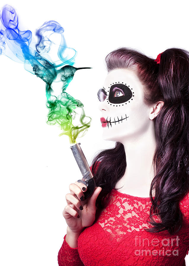 Sugar skull girl blowing on smoking gun #1 Photograph by Jorgo Photography