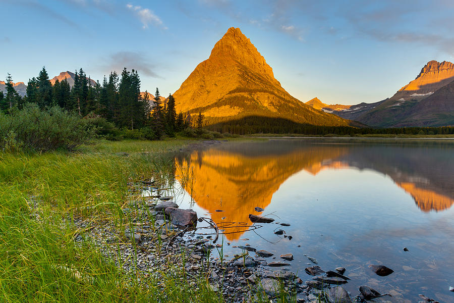 Sunrise at Swiftcurrent Lake in Glacier National Park Photograph by ...