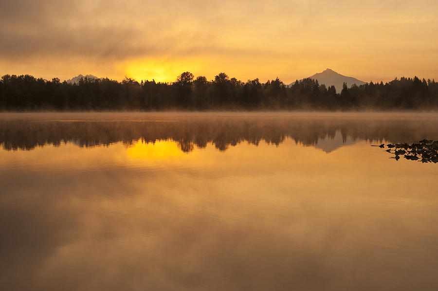 Sunrise in fog Lake Cassidy with Mount Pilchuck and reflections #1 Photograph by Jim Corwin