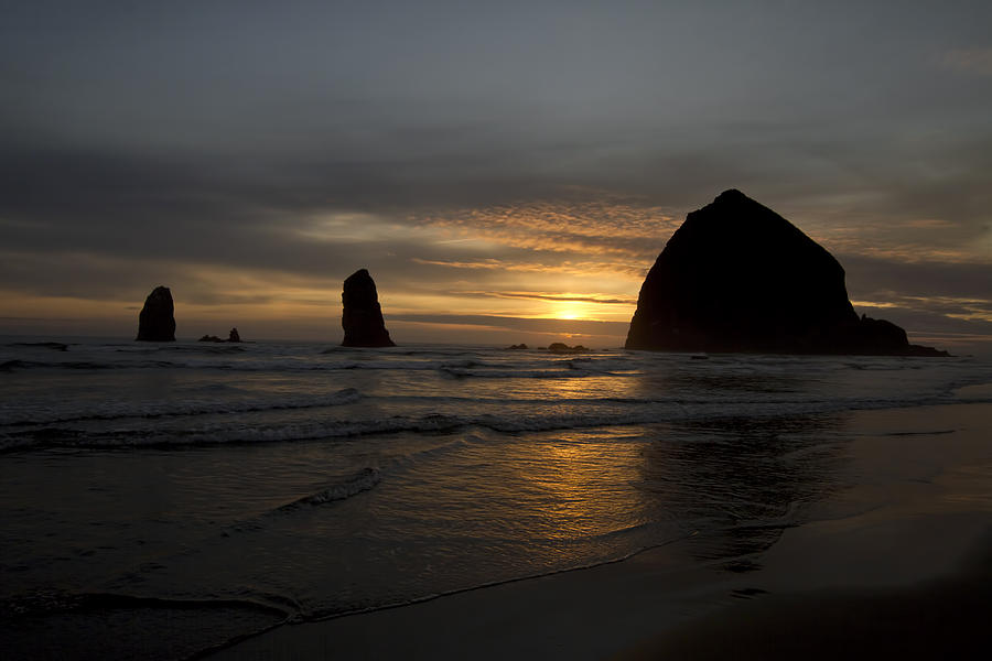 Sunset over Haystack Rock in Cannon Beach #1 Photograph by David Gn