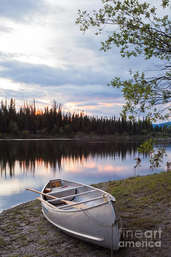Nature Photograph - Sunset sky and canoe at Teslin River Yukon Canada #1 by Stephan Pietzko