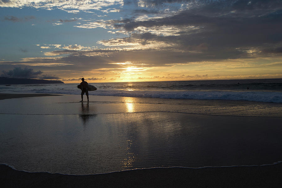 Surfer Walking On The Beach At Sunset #1 Photograph by Panoramic Images