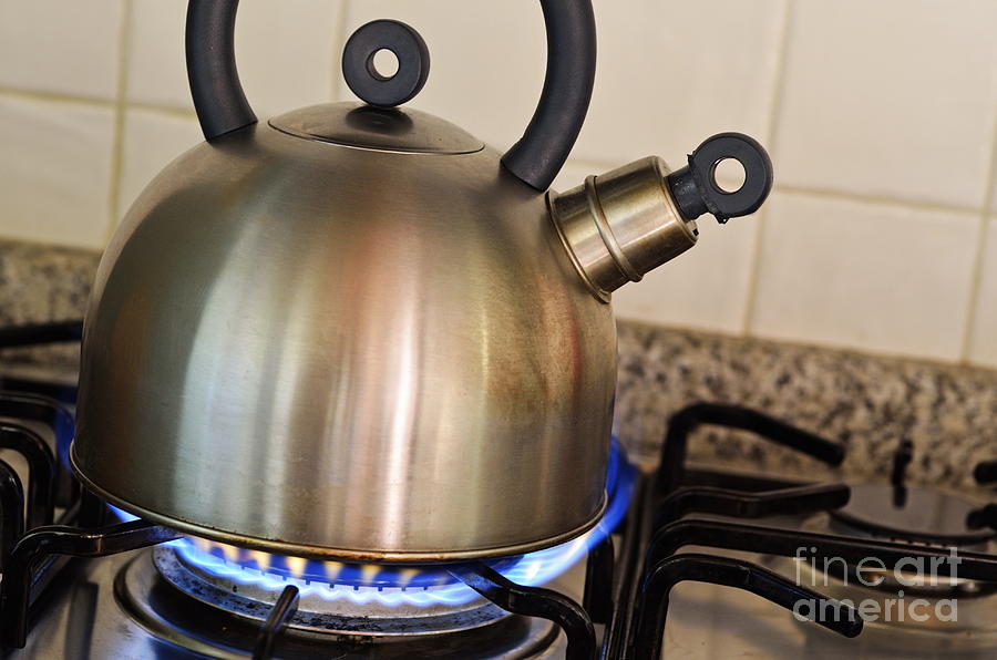 Teapot on gas stove burner Photograph by Sami Sarkis - Fine Art America