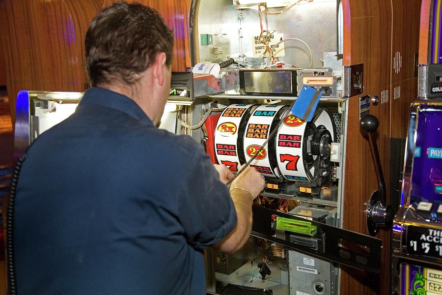 Technician Servicing A Slot Machine #1 Photograph by Jim West