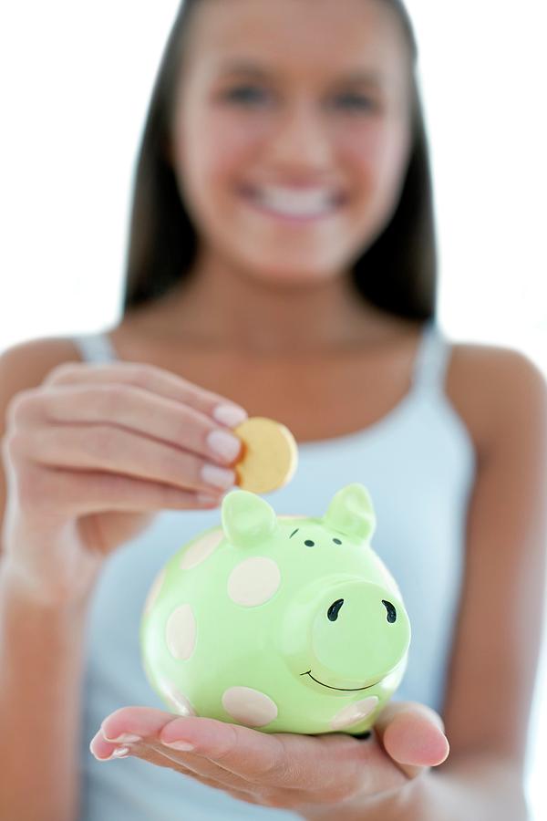 Teenage Girl Saving Money #1 Photograph by Science Photo Library Teenage Girl Saving Money #1 Photograph by Science Photo Library