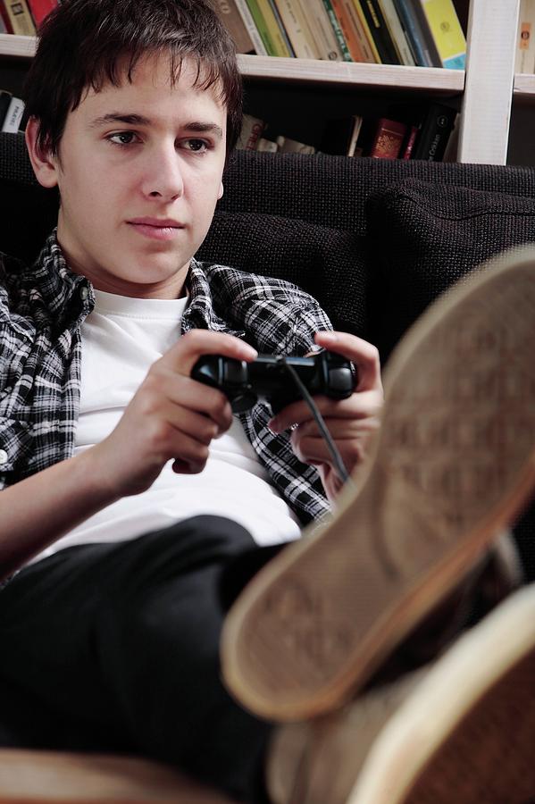 Teenager Playing A Video Game #1 Photograph by Mauro Fermariello/science Photo Library