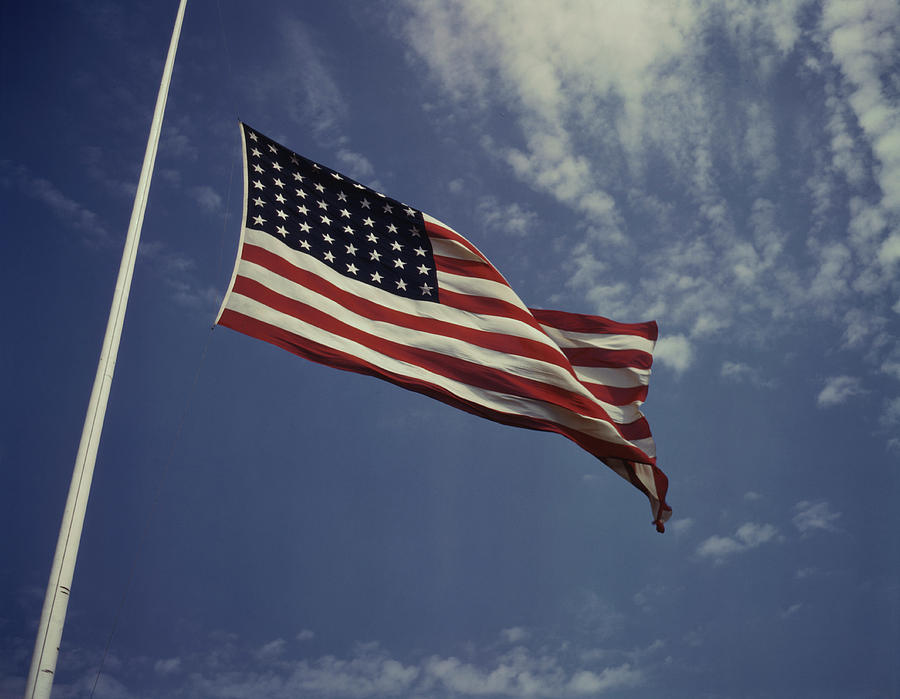 The American Flag Waving In The Wind Photograph by Stocktrek Images ...