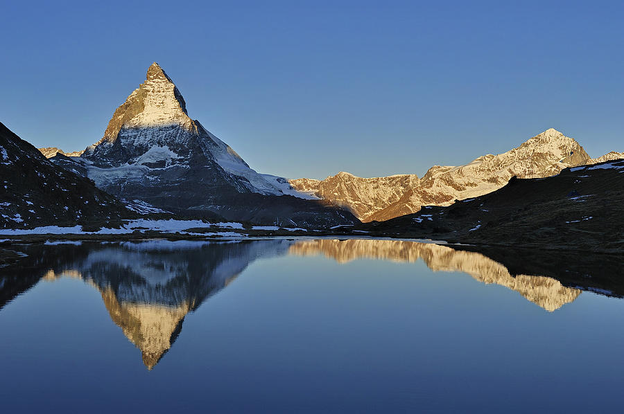 The Matterhorn And Riffelsee Lake #1 Photograph by Thomas Marent