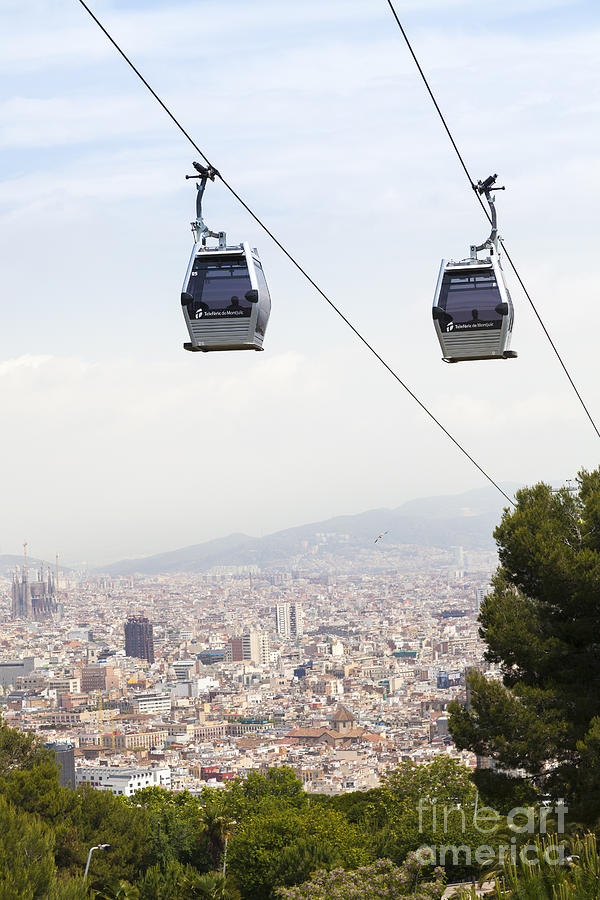 The Montjuic cable car with Barcelona Panorama #1 Photograph by Peter Noyce