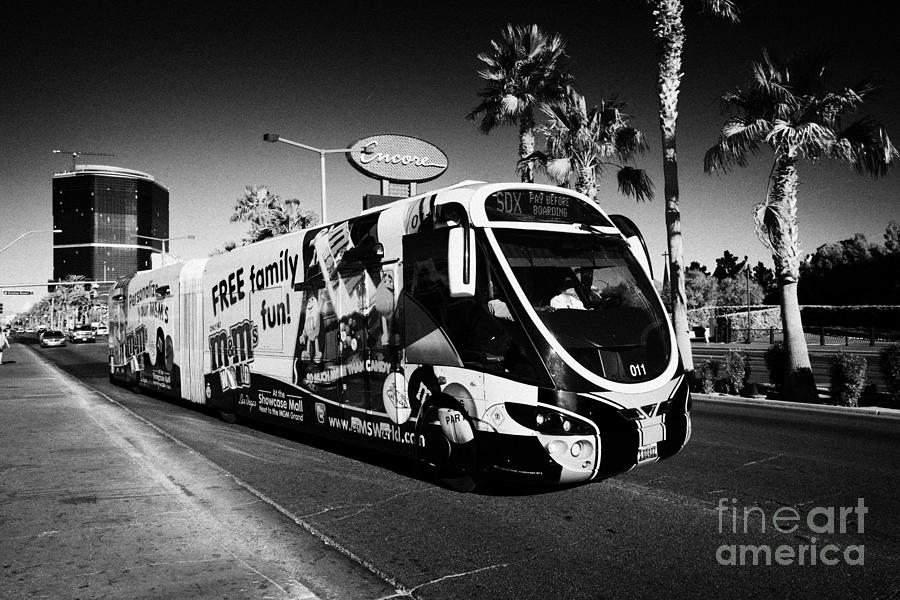 Transportation Photograph - the sdx strip downtown express bendy bus on the Las Vegas strip Nevada USA #1 by Joe Fox