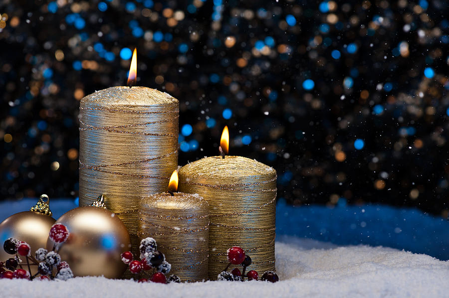 Three Gold Candles in snow  #1 Photograph by U Schade