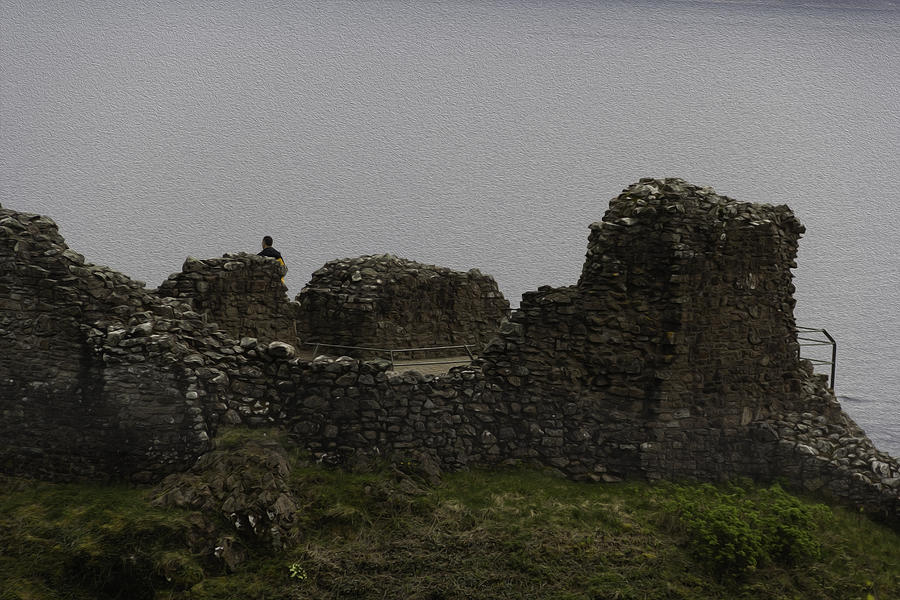 Tourist visible at the battered remains of the Urquhart Castle #1 Digital Art by Ashish Agarwal