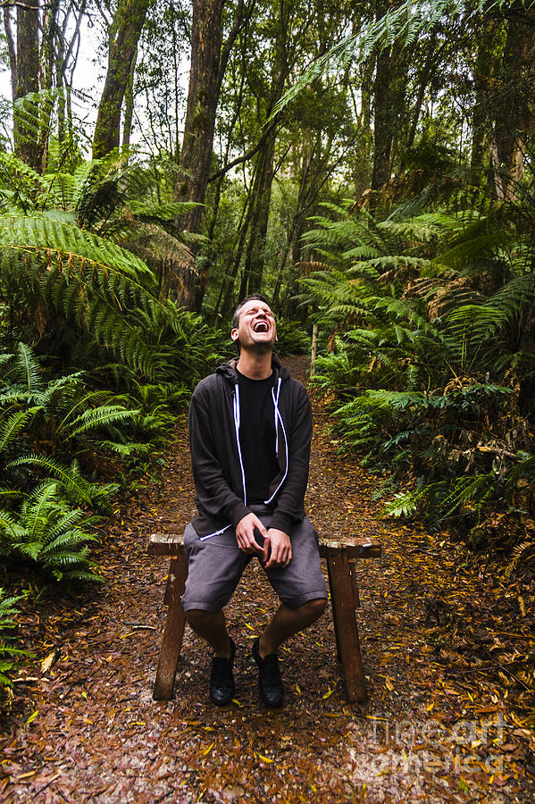 Travel man laughing in Tasmania rainforest #1 Photograph by Jorgo Photography