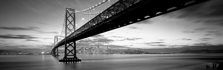 Black And White Photograph - Twilight, Bay Bridge, San Francisco #1 by Panoramic Images