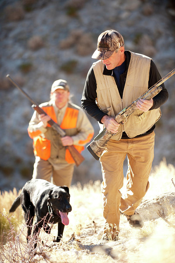 Two Hunters Track Chukar With Their Dog Photograph by Corey Rich - Fine ...