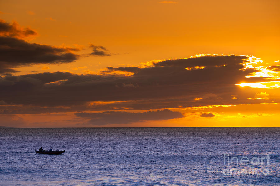 Two men paddling a Hawaiian outrigger canoe at sunset Maui Hawaii USA #1 Photograph by Don Landwehrle