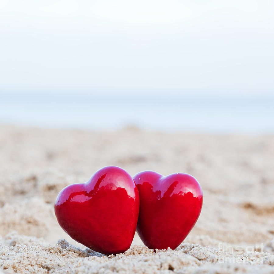 Two red hearts on the beach symbolizing love #1 Photograph by Michal Bednarek