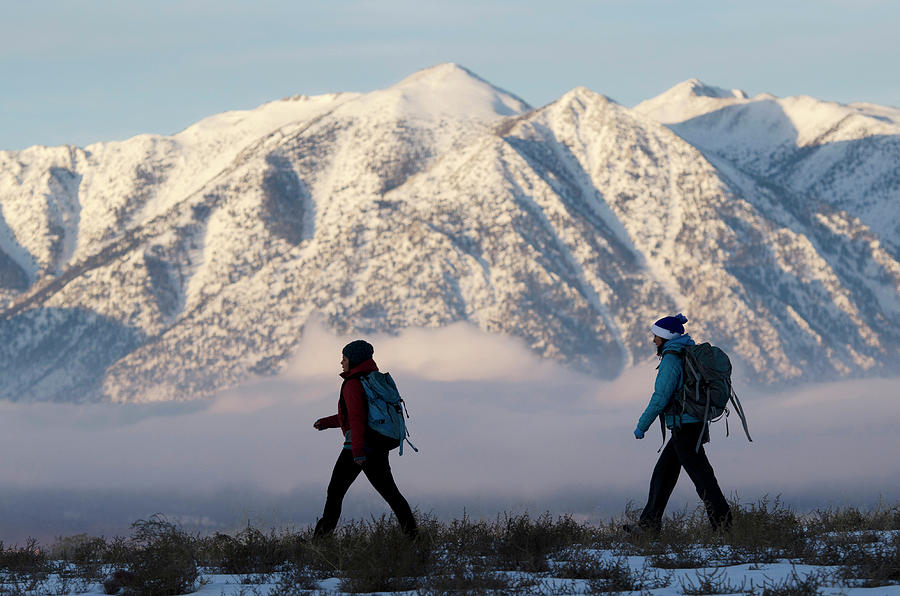 Winter Photograph - Two Women Hiking In The Sierra #1 by Corey Rich