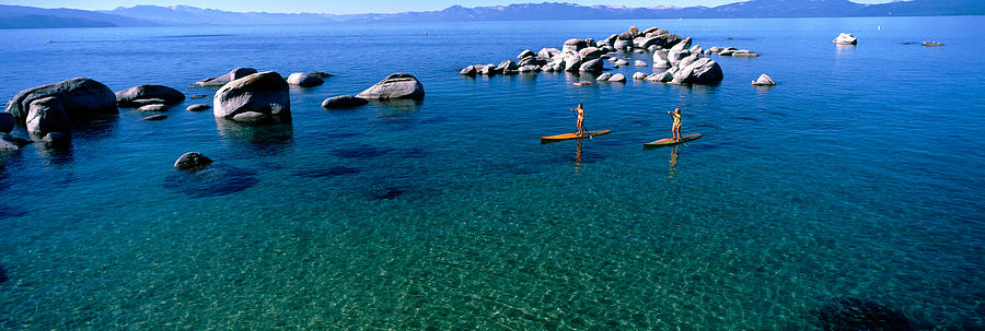 Two Women Paddle Boarding In A Lake #1 Photograph by Panoramic Images
