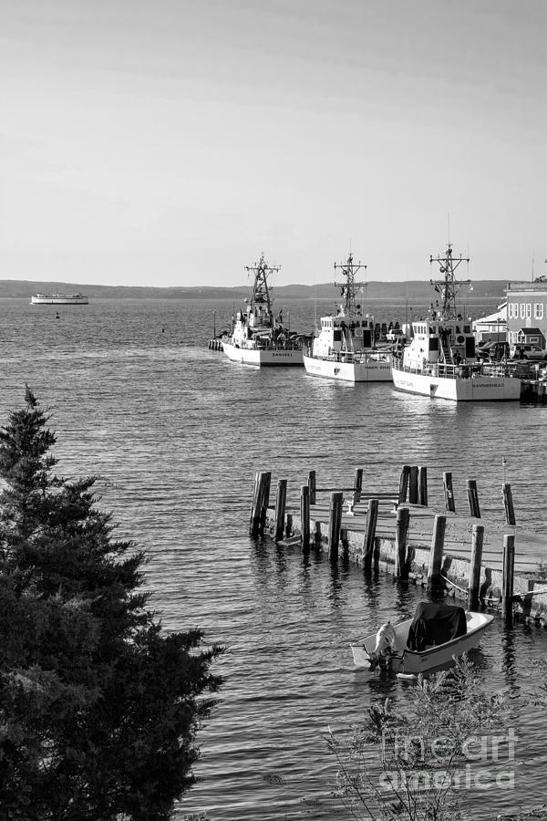 US Coast Guard cutters in a harbor at Woods Hole on Cape Cod Massachusetts. #1 Photograph by William Kuta