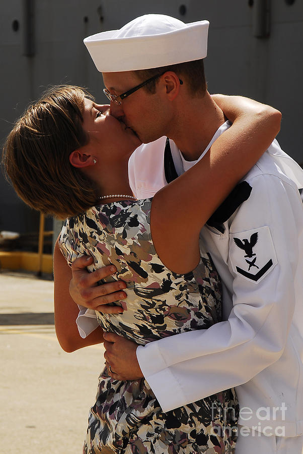 U.s. Navy Sailor Is Greeted By His Wife Photograph by Stocktrek Images