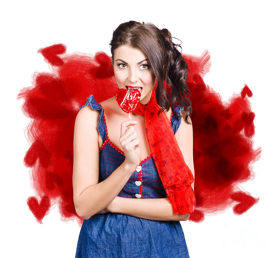 Valentines day woman eating heart candy #1 Photograph by Jorgo Photography