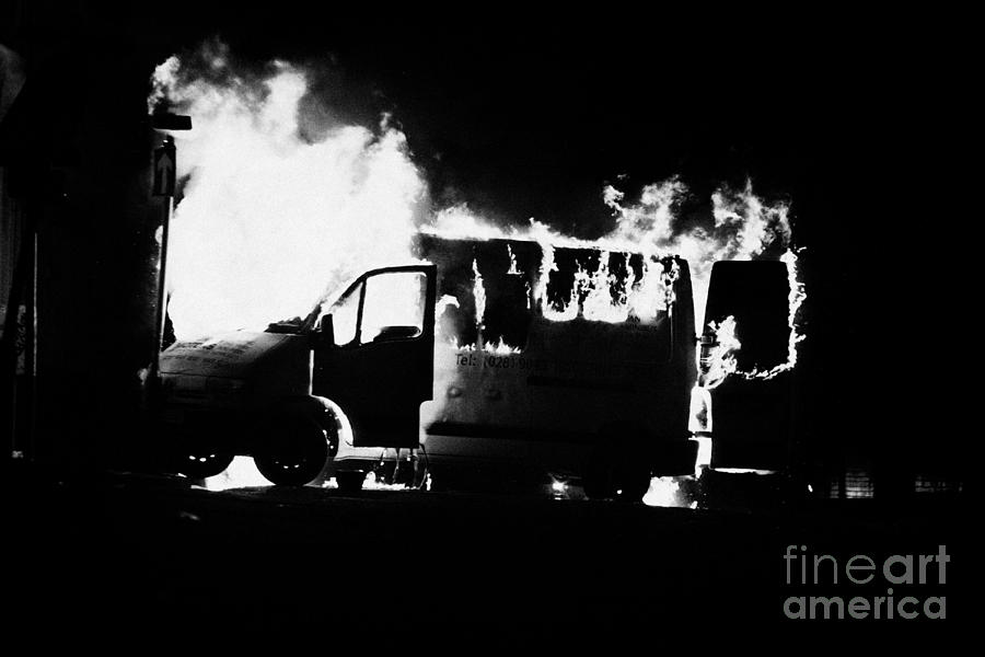 Northern Photograph - Van burning as roadblock during loyalist rioting and violence north belfast northern ireland #1 by Joe Fox