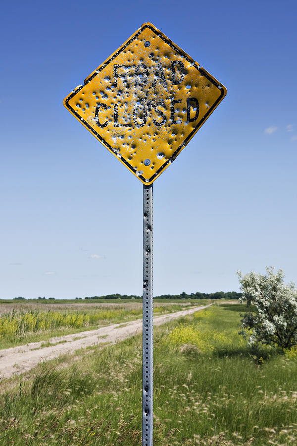 1-vandalized-road-sign-many-bullet-holes-donald-erickson.jpg