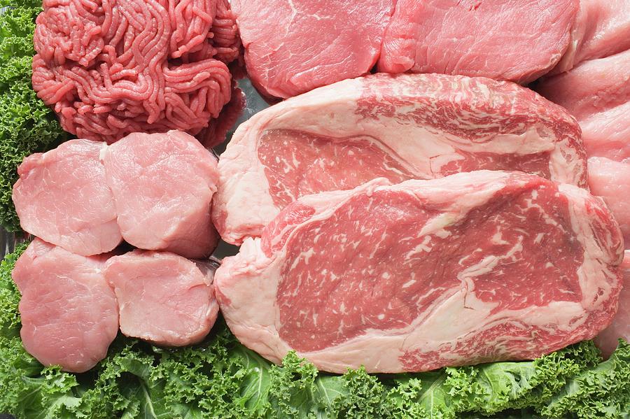 Still Life Photograph - Various Types Of Meat Surrounded By Parsley #1 by Foodcollection