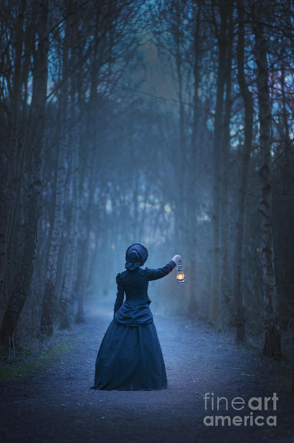 Victorian Or Edwardian Woman Holding An Oil Lamp At Night #1 by Lee Avison