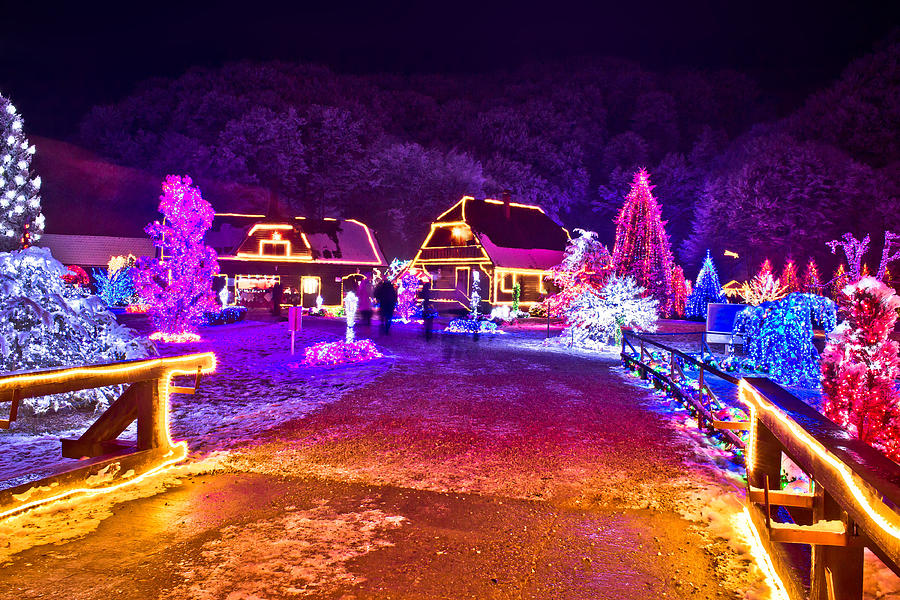 Village in colorful christmas lights  #1 Photograph by Brch Photography