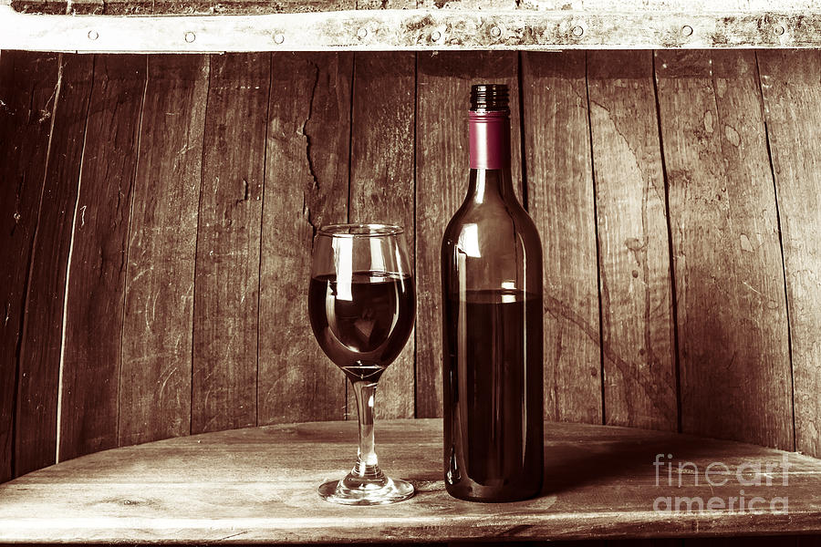 Vintage red wine in old winery cellar barrel  #1 Photograph by Jorgo Photography