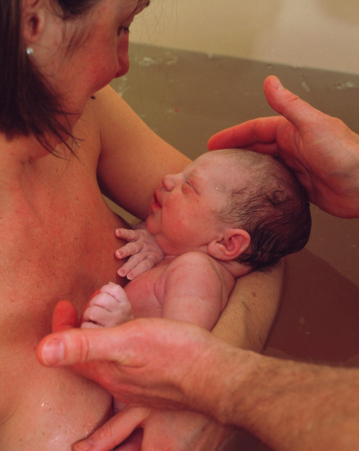 Water Birth: Mother Holds Her Newborn Baby #1 Photograph by Hattie Young/science Photo Library