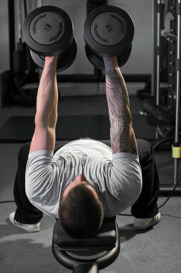 Weight Training #1 Photograph by David Woodfall Images/science Photo Library