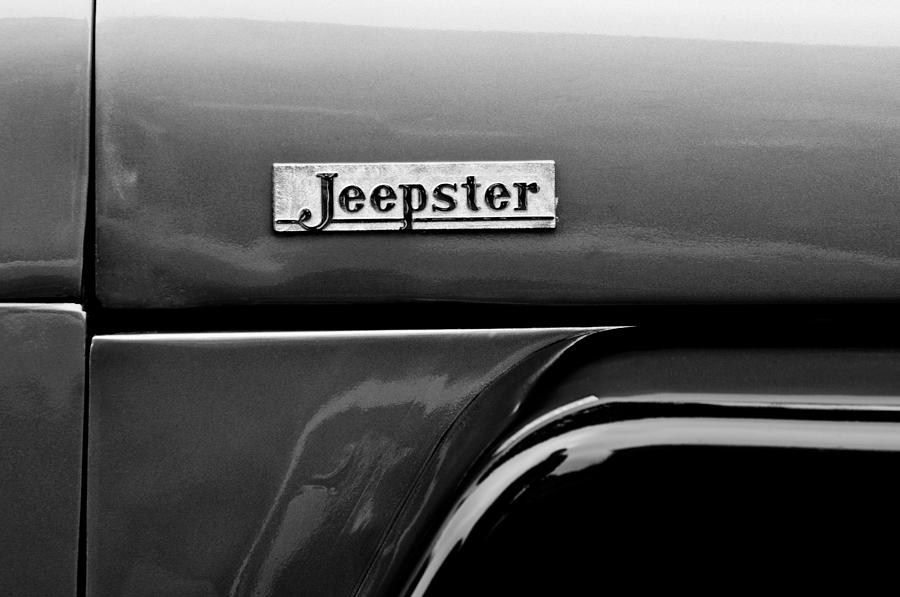 Black And White Photograph - Willys Jeepster Side Emblem #1 by Jill Reger