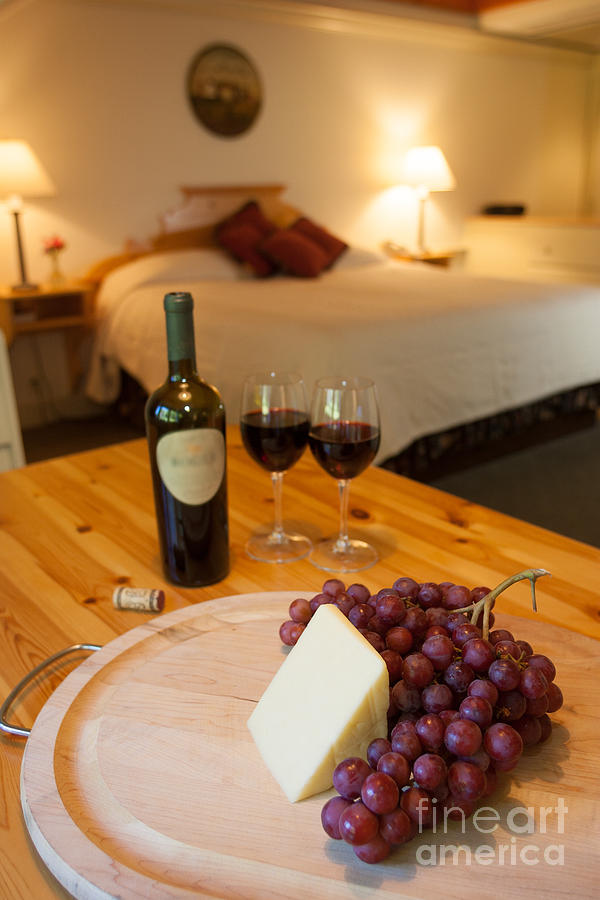 Wine and cheese in a luxurious hotel room. #1 Photograph by Don Landwehrle