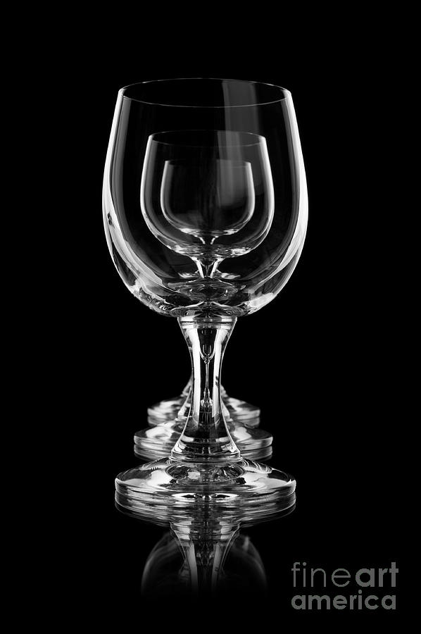 Three empty wine glasses on black in a row  Photograph by Arletta Cwalina