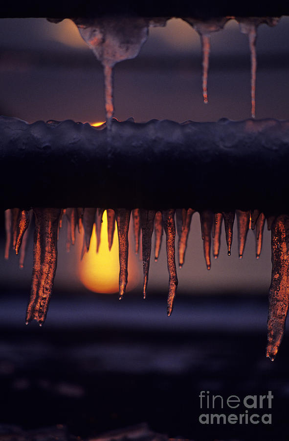 Winter scene with icicles hanging from park bench at sunset West #2 Photograph by Jim Corwin