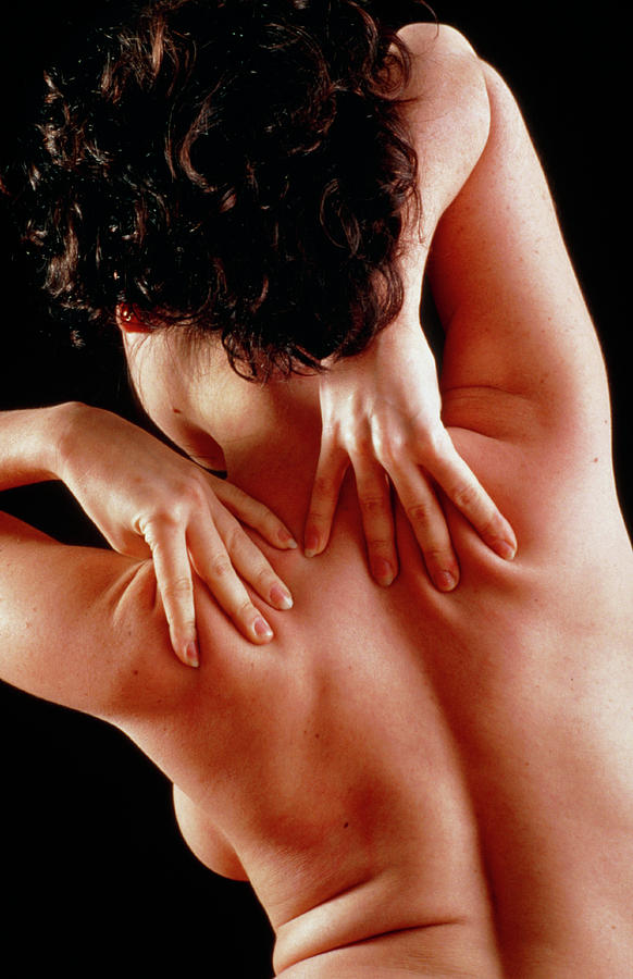 Woman Affected By Shoulder Pain Doing Self-massage #1 Photograph by Seth Joel/science Photo Library