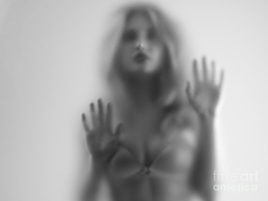 Woman blurred silhouette behind hazy glass #1 Photograph by Maxim Images Exquisite Prints