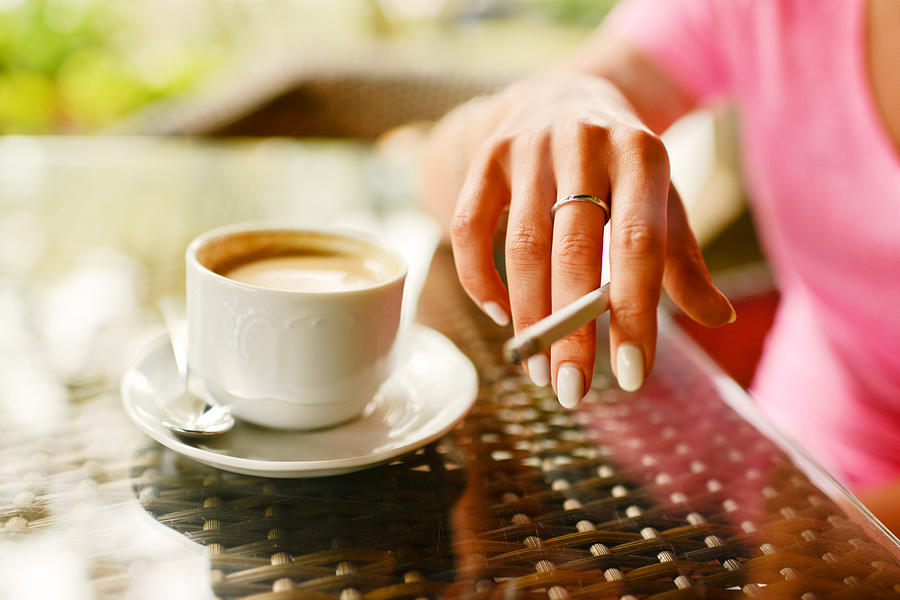 Cup Photograph - Woman drinking coffee and smoking in outdoors cafe #1 by Anna Bryukhanova