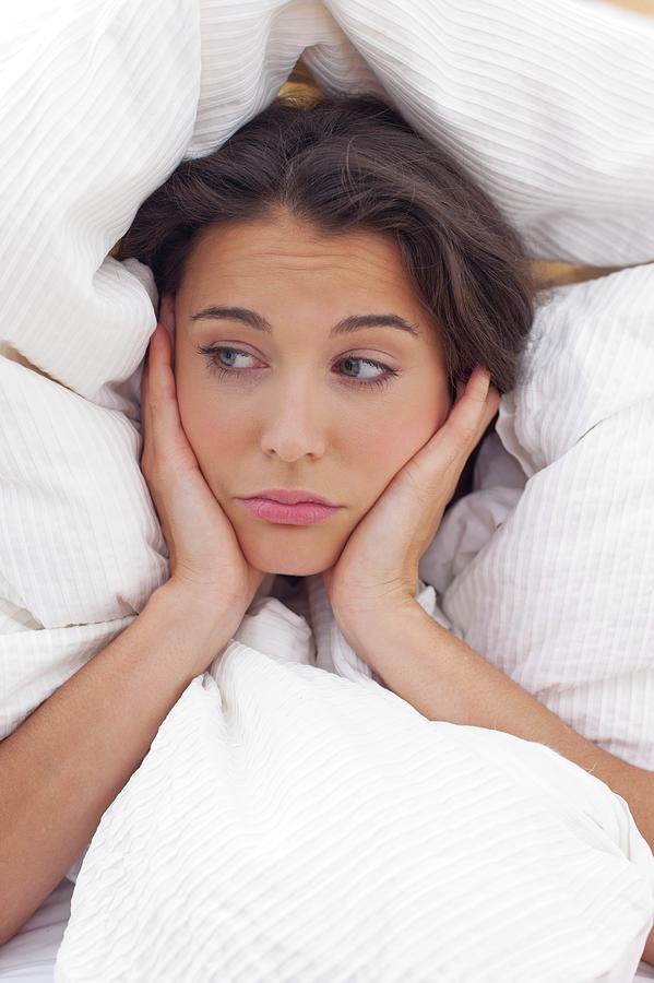 Woman In Bed With Hands On Chin Photograph By Ian Hooton Fine Art America