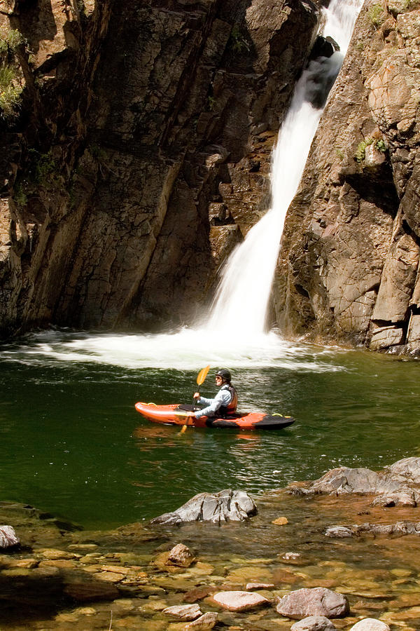 Mountain Photograph - Woman In Kayak Below Waterfall #1 by Kennan Harvey