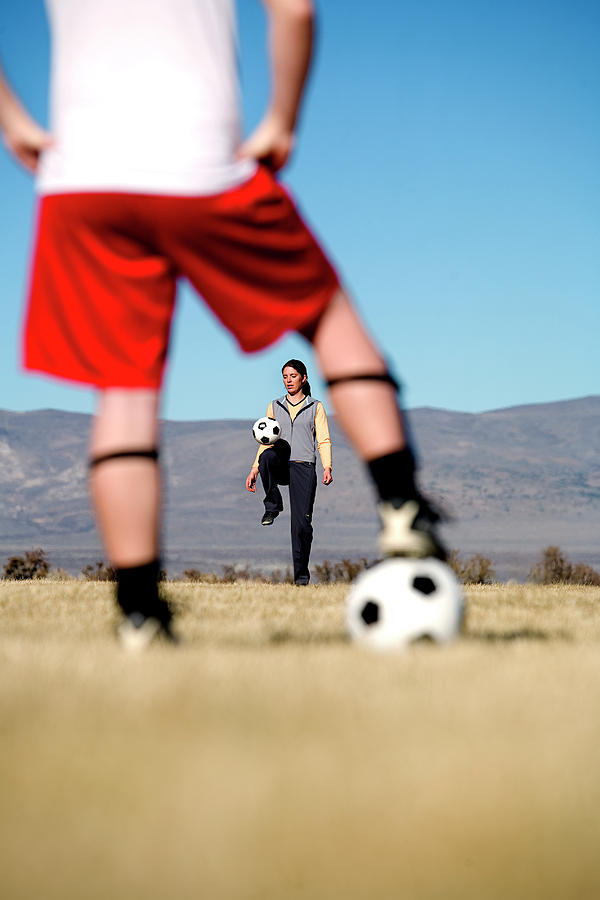 Woman Juggling A Soccer Ball And Framed Photograph by Corey Rich Fine