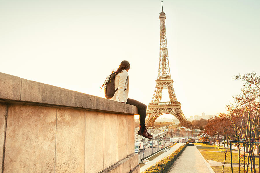 Woman looking at the Eiffel Tower in Paris #1 Photograph by Orbon Alija