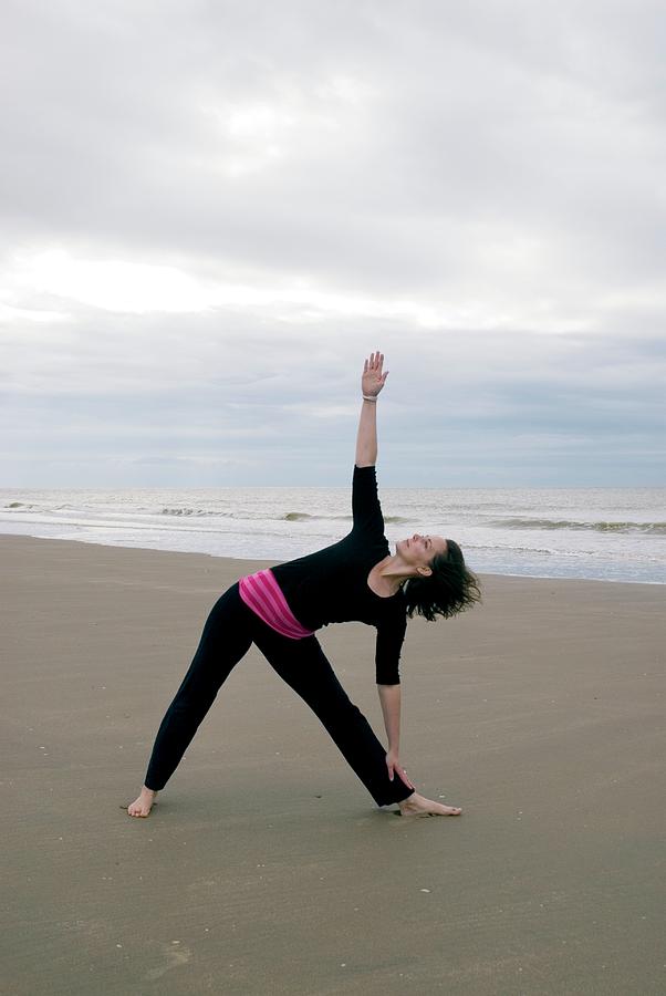 Woman Performing Yoga Exercise Photograph by Suzanne Grala/science ...