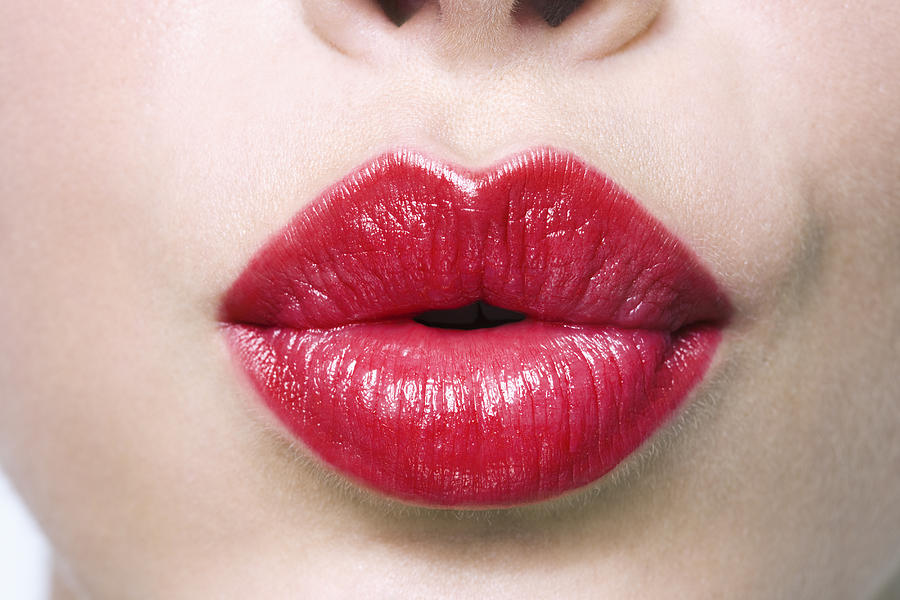 Woman puckering lips, close-up #1 Photograph by Pando Hall