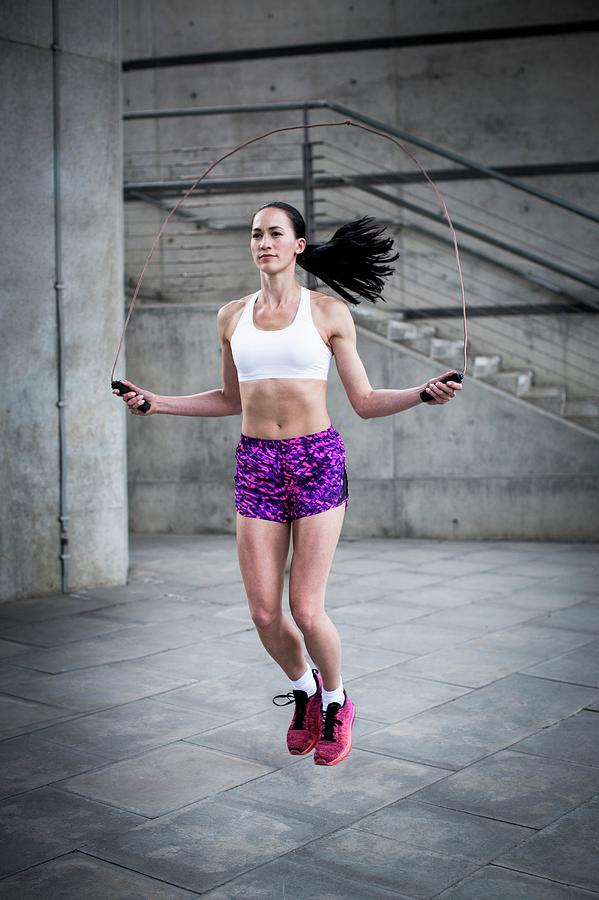Sports Photograph - Woman Skipping With Rope #1 by Science Photo Library