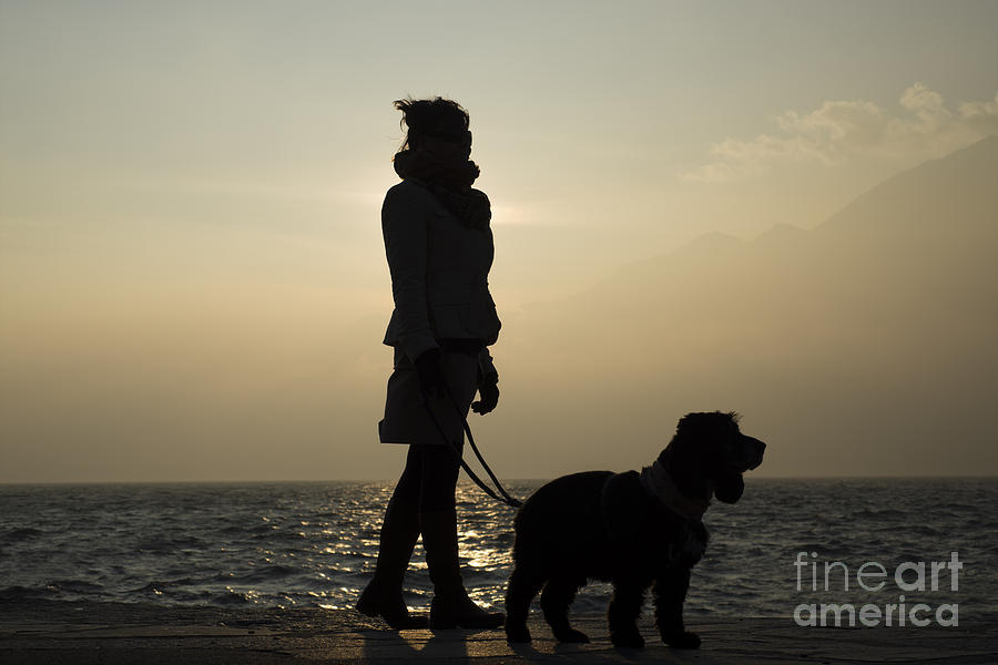 Woman walking with her dog #1 Photograph by Mats Silvan